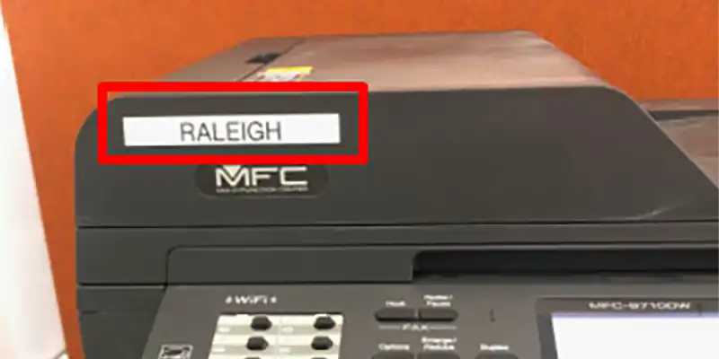 A printer with a red box around the name of the printer.