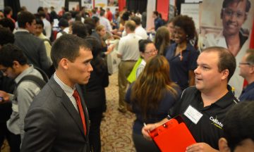 A student talking with a recruiter at the Spring 2023 Engineering Career Fair