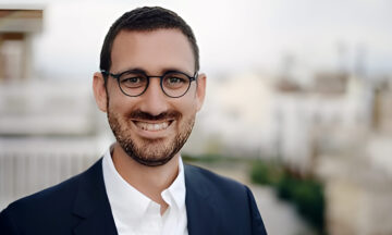 A headshot of David Cornejo standing outside.