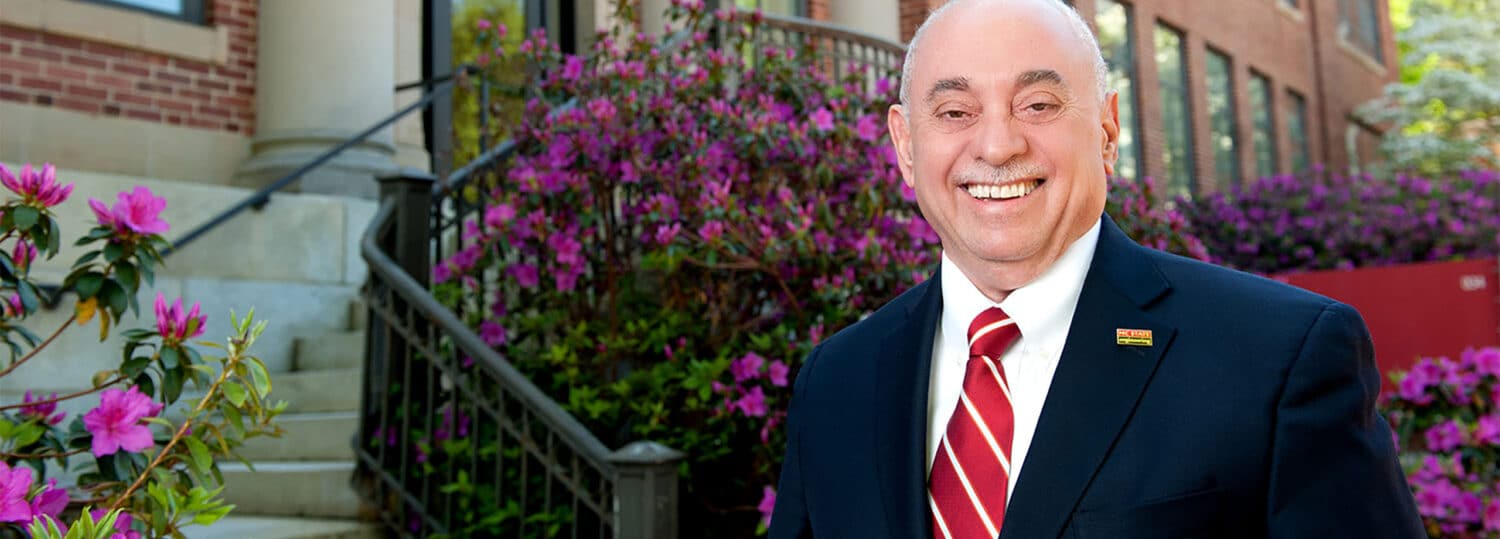 Louis Martin-Vega is standing outside of Page Hall on NC State's Main Campus.