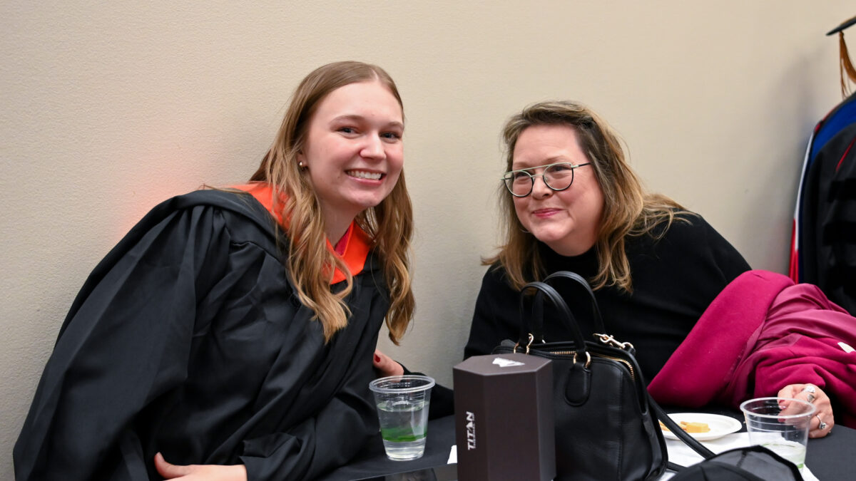 OR Students celebrating graduation during reception.