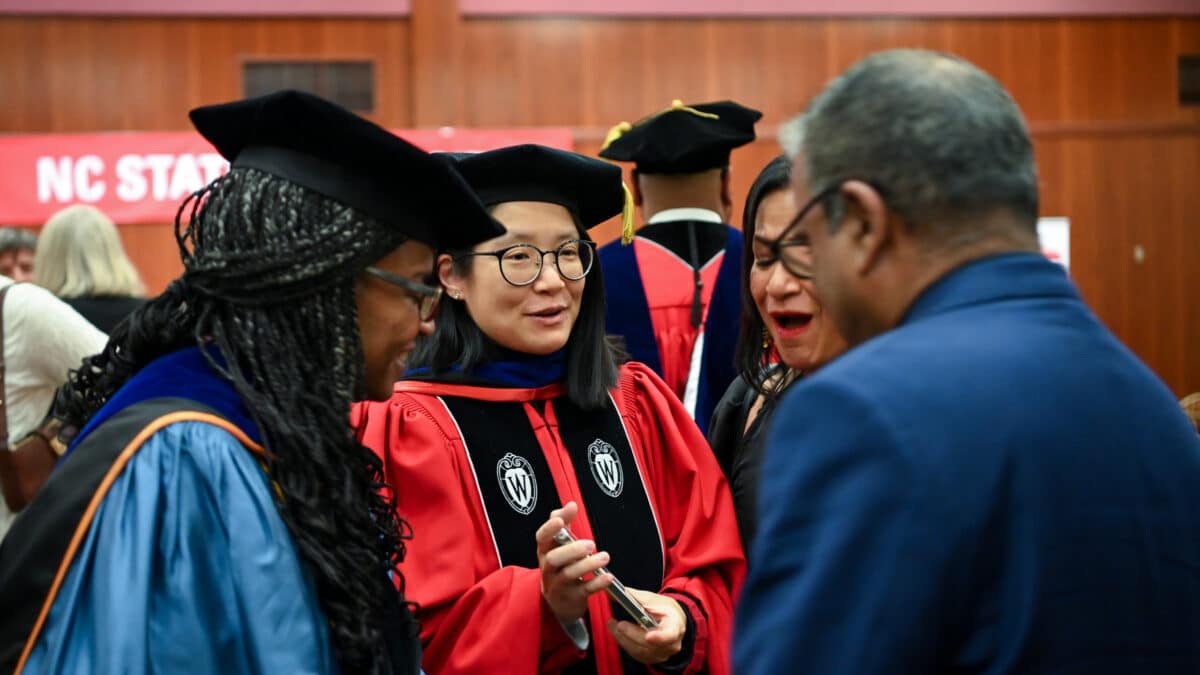 OR Students celebrating graduation during reception.