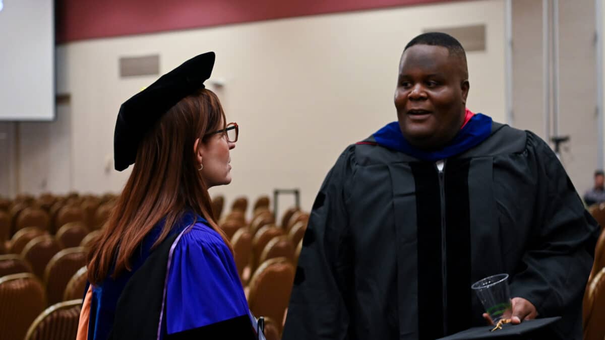 OR Students celebrating graduation during reception.