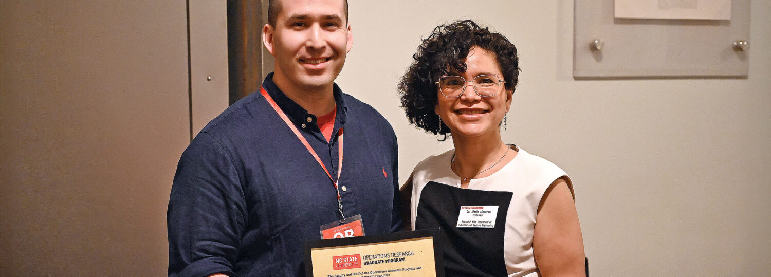 WIll Kirschenman receiving his award from Maria Mayorga