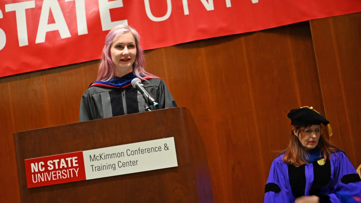 OR Alumna Natalia Summerville steps to the podium and delivers her commencement address