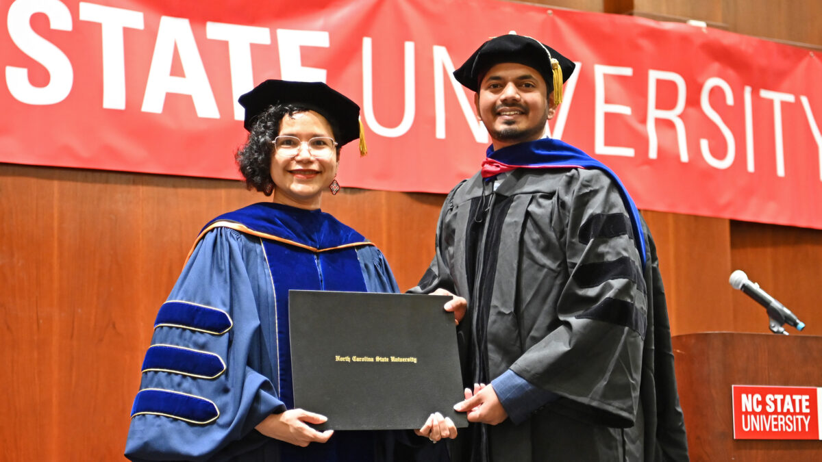 OR Ph.D. student, Soham Mudalgikar, poses with OR Director, Maria Mayorga, as he receives his degree
