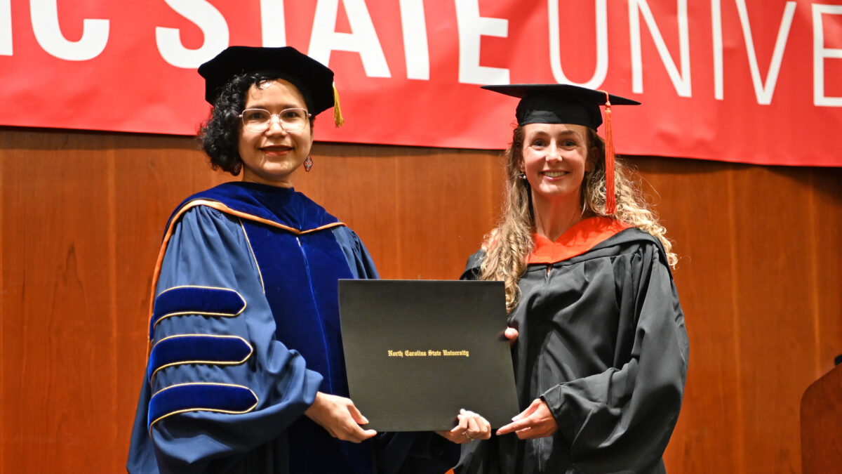 OR MSOR student, Kelsey Power, poses with OR Director, Maria Mayorga, as she receives her degree