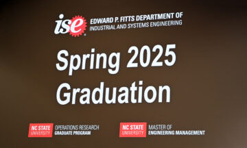 A welcome message to the OR Spring 2025 Graduation Ceremony shown on a giant screen
